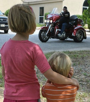 Children Holding Ears From Loud Motorcycles